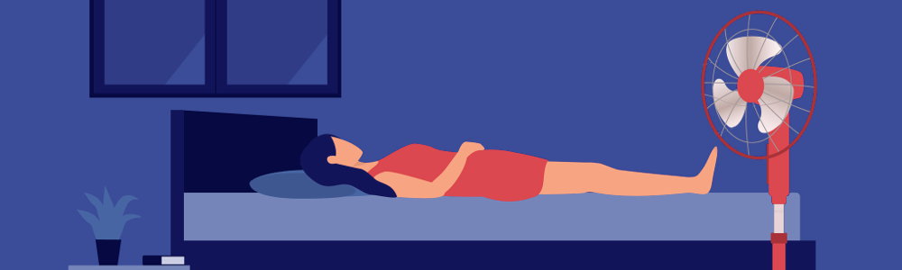 An illustration of a person lying in bed with a fan blowing on them